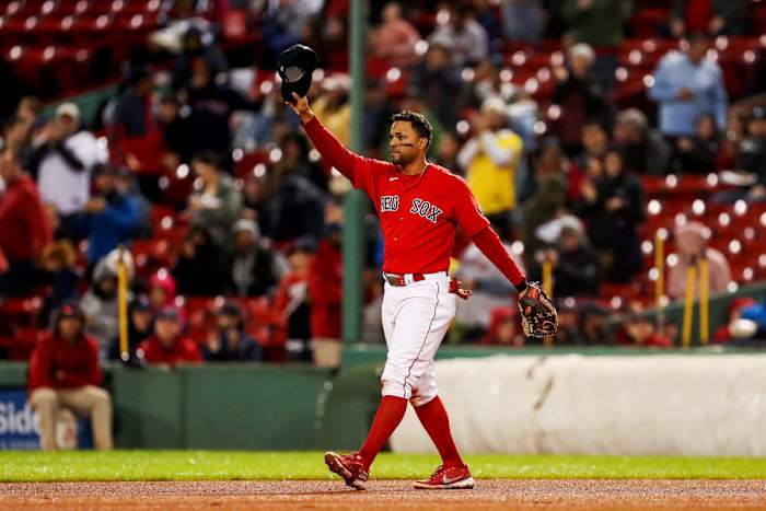 Red Sox shortstop Xander Bogaerts waves to the crowd as he leaves the field in his final game before reaching free agency.